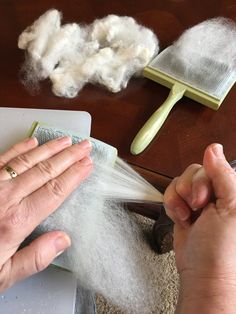 someone is cleaning their hands with cotton on the table