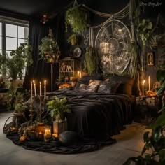 a bed with lots of plants and candles on top of it in front of a window