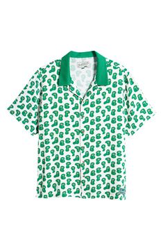 Broadcast your love for the game on or off the course in this drapey shirt printed with flags. Front button closure Notched collar Short sleeves 100% rayon Dry clean Imported Casual Green Shirt With All Over Print, Casual Collared Camp Shirt With Graphic Print, Green Casual Short Sleeve Shirt With Graphic Print, Green Top With All Over Print And Camp Collar, Casual Green Tops For Golf, Green Collared Tops With Graphic Print, Casual Green Short Sleeve Shirt With Graphic Print, Green Cotton Tops For Golf, Casual Summer Golf Shirt