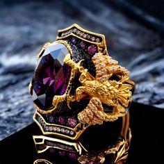 We used amethyst stones on our 925 sterling silver eagle ring warrior ring we made 3D double headed eagle on crossed double sword the coloring of the ring is 24k gold plated eagle men ring, 20-25 grams.  Double headed eagle, sword ring, amethyst stones, eagle men ring, warrior ring, gold plated, crossed double sword, eagle PRODUCT DETAILS * Made to Order * Certified 925 sterling silver * Your ring comes in a pretty ring box ready for gift giving. RING SIZE *It is always safer to see a jeweler to Gold Men Ring, Ring Symbolism, Warrior Ring, Modern Mens Rings, Double Headed Eagle, Ring Size Chart, Eagle Ring, Mens Rings Fashion, Pretty Ring