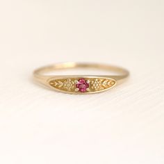 October birth ring This ring will be a very meaningful piece for those born in October. October's birthstone and birth flower are Pink tourmaline and Marigold. Romantic pink tourmaline and delicately carved marigold will shine and bloom forever. This dainty and slim signet ring is comfortable to wear all the time. This piece will be perfect gift for both to others and yourself. * Detail * Material : 14K solid gold, 18K solid gold, 925 sterling silver Color : Yellow gold, White gold or Rose gold(925 sterling silver is excluded) Stone : Natural Pink tourmaline (2.5mm) * Size * Top width : 3.7mm Shank width : 1.2mm Band depth : 2.4-0.9mm We provide special package with some our business card, guarantee card, gift box. Please check our shop policies and we love to hear from you about anything. Birth Ring, Pink Stone Engagement Rings, October Jewelry, Birthstone Engagement Rings, October Birthstone Rings, Pink Tourmaline Ring, Ring Birthstone, Meaningful Jewelry, Jewelry Studio