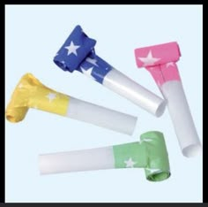 four different colored candy sticks with stars on them