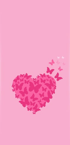 the heart is surrounded by butterflies on a pink background