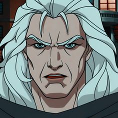 the white haired man with blue eyes is staring at something in front of his face