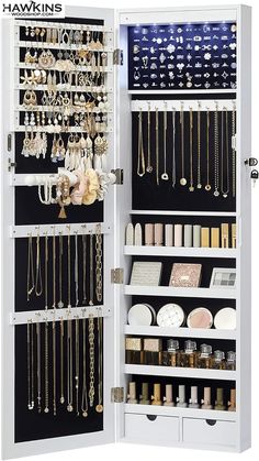 a white cabinet filled with lots of jewelry