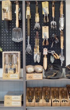 there are many different types of tools on the shelves in this store that is filled with items