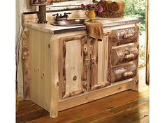 a bathroom vanity made out of an old wooden cabinet