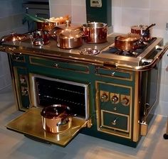 an old fashioned stove with pots and pans on it