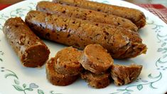 several sausages are on a plate ready to be eaten