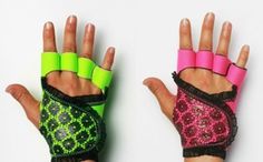 two hands wearing neon colored gloves with black laces and pink, green, and yellow wrist wraps