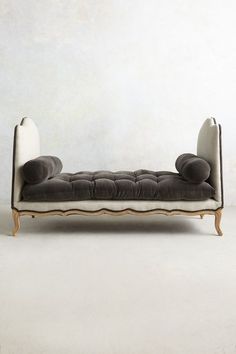 a black and white couch sitting on top of a floor