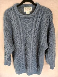 This is a Vintage Aran !00% Merino Wool Cable Knit Crewneck Pullover Sweater Sz M. Made on the Aran Island in Ireland it has been gently worn and is in like new condition. Measurements Length 32" Shoulders 26" Sleeves 23" Chest 48" Cableknit Sweater, Gray Sweater, Icelandic Wool Sweaters, Aran Sweater, Fisherman Sweater, Wool Sweaters, Grey Sweater, Cable Knit, Pullover Sweaters