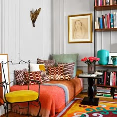 a living room filled with lots of colorful furniture