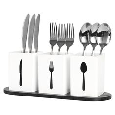 the forks, spoons and knives are placed in white containers with black trimmings