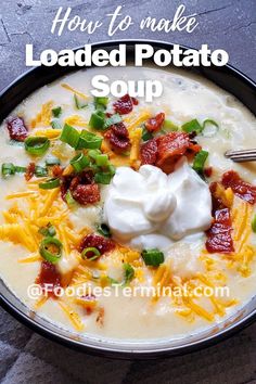 a bowl of loaded potato soup with sour cream