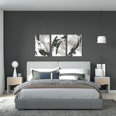 a modern bedroom with grey walls and white bedding, two paintings on the wall