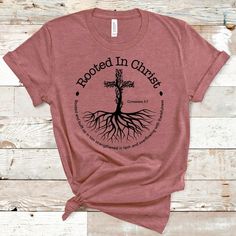 Introducing our Rooted in Christ T-Shirt, a powerful expression of your faith and a stylish addition to your wardrobe. Designed with a passion for spreading the message of Christ's love and teachings, this t-shirt serves as a daily reminder of your spiritual connection and the values that shape your life. This classic unisex jersey short sleeve tee fits like a well-loved favorite. Soft cotton and quality print make users fall in love with it over and over again.  .: 100% Airlume combed and ringspun cotton (fiber content may vary for different colors) .: Light fabric (4.2 oz/yd² (142 g/m .: Retail fit .: Tear away label .: Runs true to size CARE INSTRUCTIONS Wash item inside out in cold water Do not bleach Do not dry clean Do not iron directly on the design. Tumble dry low. NOTE: All appare Rooted In Christ Shirt, Church Shirt Designs, Scripture Tshirts, Church Tshirts, Rooted In Christ, Christ Shirts, Christian Clothing Brand, Christian Tee Shirts, Christian Tshirt Design