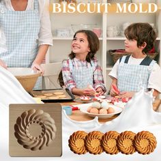 an advertisement for biscuit molds featuring three children making cookies and baking with their mother