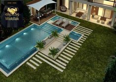 an aerial view of a house with a swimming pool and lounge chairs in the yard