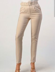 High waist slim fit pant with belt and front pockets. Minimal Stretch. 95% Polyester, 5% Spandex **Run small** IMPORTANT: (You must choose a size larger than the one you normally choose because these pants run small) **Corre pequeño** IMPORTANTE: (Debes escoger una talla mayor a la que normalmente escoges porque este pantalón corre pequeño) ✔️ Style: Casual - Elegant ✔️ This piece is ideal for office, resort, vacation, cruising, brunch, birthday, anniversary, etc. 💛 Follow us on Facebook , Inst Chic Mid-rise Belted Bottoms, Fitted Beige Belted Pants, Fitted Belted Bottoms For Business Casual, Fitted Belted Bottoms For Office, Fitted Belted Tapered Leg Pants, Fitted Belted Solid Bottoms, Fitted Belted Ankle-length Pants, Fitted Ankle-length Belted Bottoms, Belted Tapered Leg Bottoms For Business Casual