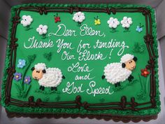 a green sheet cake with sheep and flowers on the side that says dear ellen, thank you for serving our book and god's special