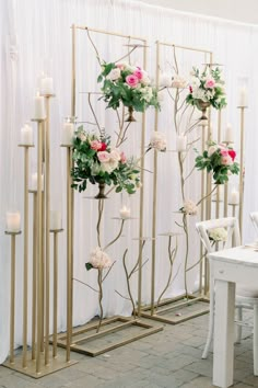 a room divider decorated with flowers and candles