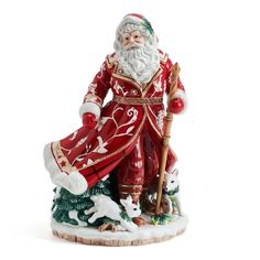 a santa clause figurine holding a staff