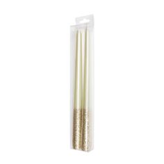 two white candles with gold glitter on them in a plastic package, sitting side by side