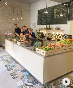 people are sitting at the counter in a restaurant