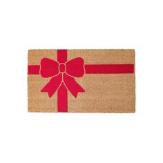 a door mat with a red bow on it