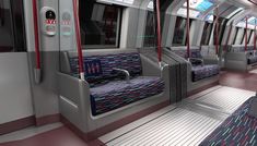 the interior of a subway train with red and blue seats