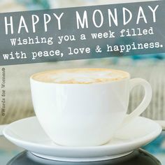 a cup of coffee sitting on top of a saucer next to a sign that says happy monday wishing you a week filled with peace, love & happiness