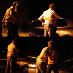 two people standing next to each other in front of a car at night and one person hugging another