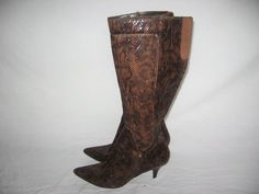 Vintage Nine West NWPickWick Textile Upper Balance Man Made Brown Black Snake Animal Print Stiletto High Heel Side Zipper Calf High Boots   Size:  8 M  Height:  17 1/4"  Outside length toe to heel against wall:  10 3/" Width:  3 3/8" Heel Height:  3"  See pictures for condition  Please contact ANVINTRO with any questions regarding this item Nine West Boots, Snake Boots, Calf High Boots, West Boots, How To Make Brown, Black Snake, La Pointe, High Heels Stilettos, 8 M