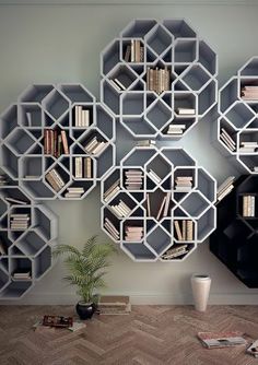 the bookshelves are arranged as hexagonal shelves