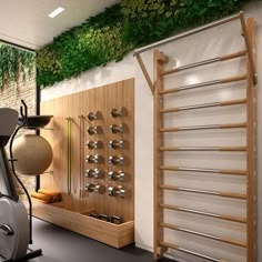 an exercise room with treadmills and plants on the wall