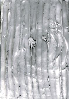 an image of icicles on the side of a window pane that looks like it has been frosted