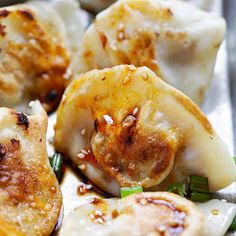 some dumplings with meat and vegetables on a piece of tin foil