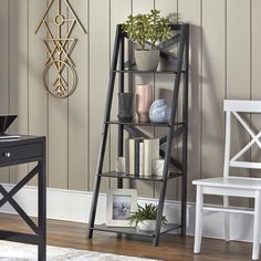 a room with a desk, chair and book shelf