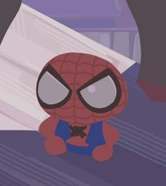 a cartoon spider man sitting in front of a pile of papers with eyes wide open