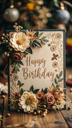 a happy birthday card with flowers on it