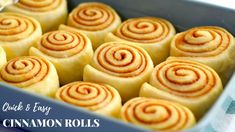 cinnamon rolls sitting in a blue dish on top of a table