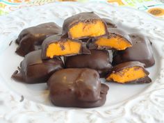 several pieces of chocolate on a white plate