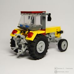 a lego model of a tractor with wheels