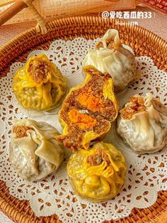 some dumplings are sitting on a doily