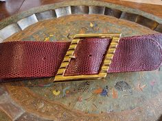 32" Vintage Mondi Accessories Brass and Burgundy Leather Belt Made in West Germany. Has a satisfyingly heavy buckle. Reptile embossed texture. Excellent condition.  2.25" x 37" overall length, not including buckle measurement. Holes at 29, 30, 31, 32, 33". Vintage: Just like Grandma, the dings and bruises of vintage are part of her lovely package, so please love her as she is, with all of her signs of an authentically lived life. You wouldn't want her any other way. All sales final. Vintage Font, Suspender Belt, West Germany, Suspenders, Reptiles, Leather Belt, Belts, Beauty Book, Etsy Accessories