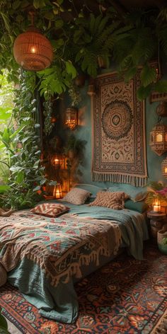 a bed sitting under a lush green tree filled with lots of leaves and candles on top of it