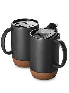 two black coffee mugs with lids and handles