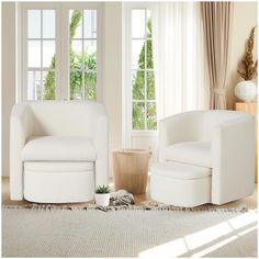 a living room with two white chairs and a potted plant in front of the window