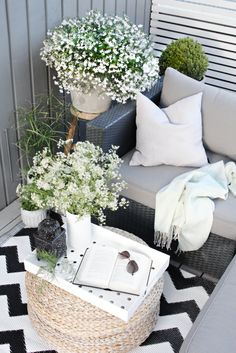 a couch and table with flowers on it